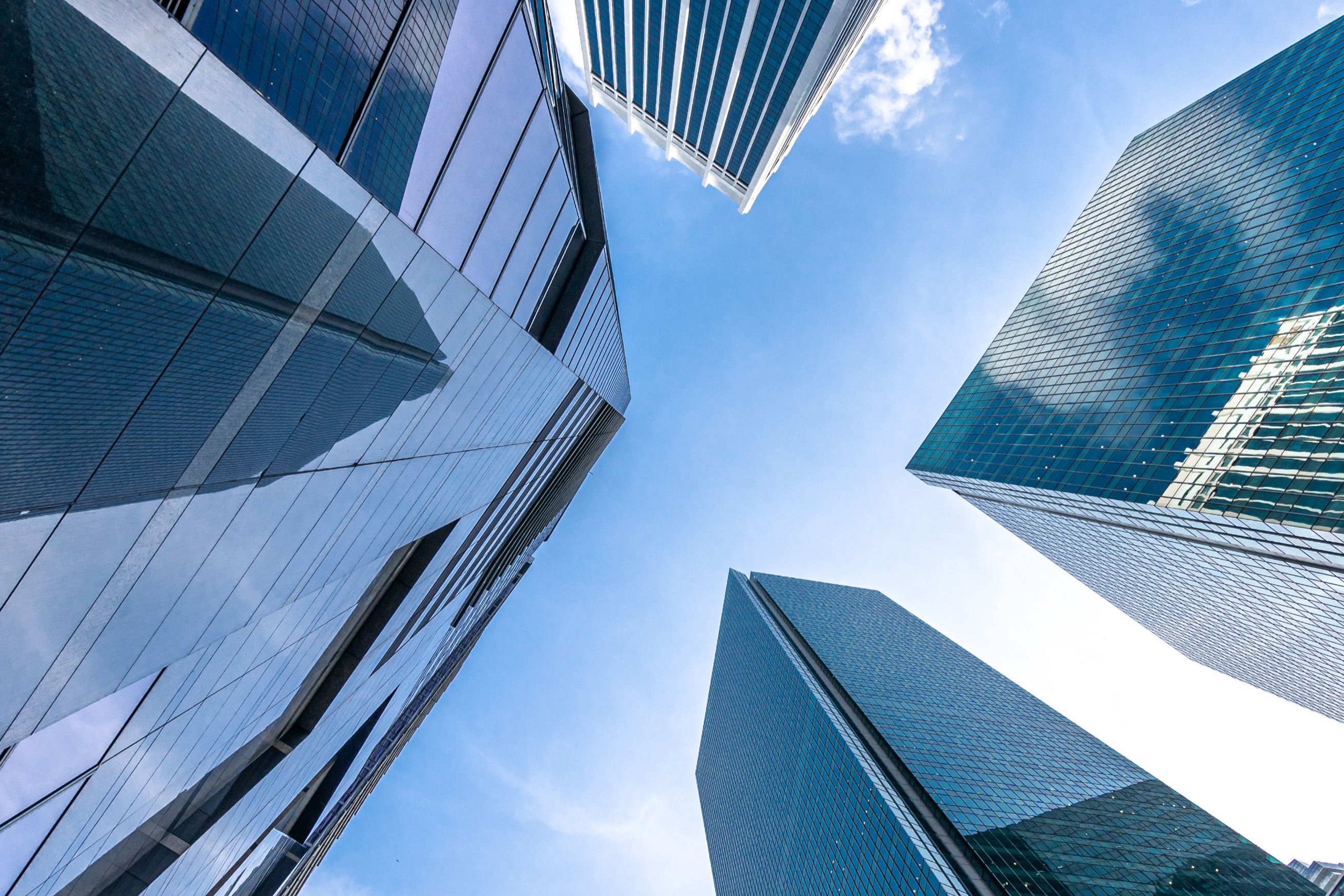 Looking to the sky through buildings